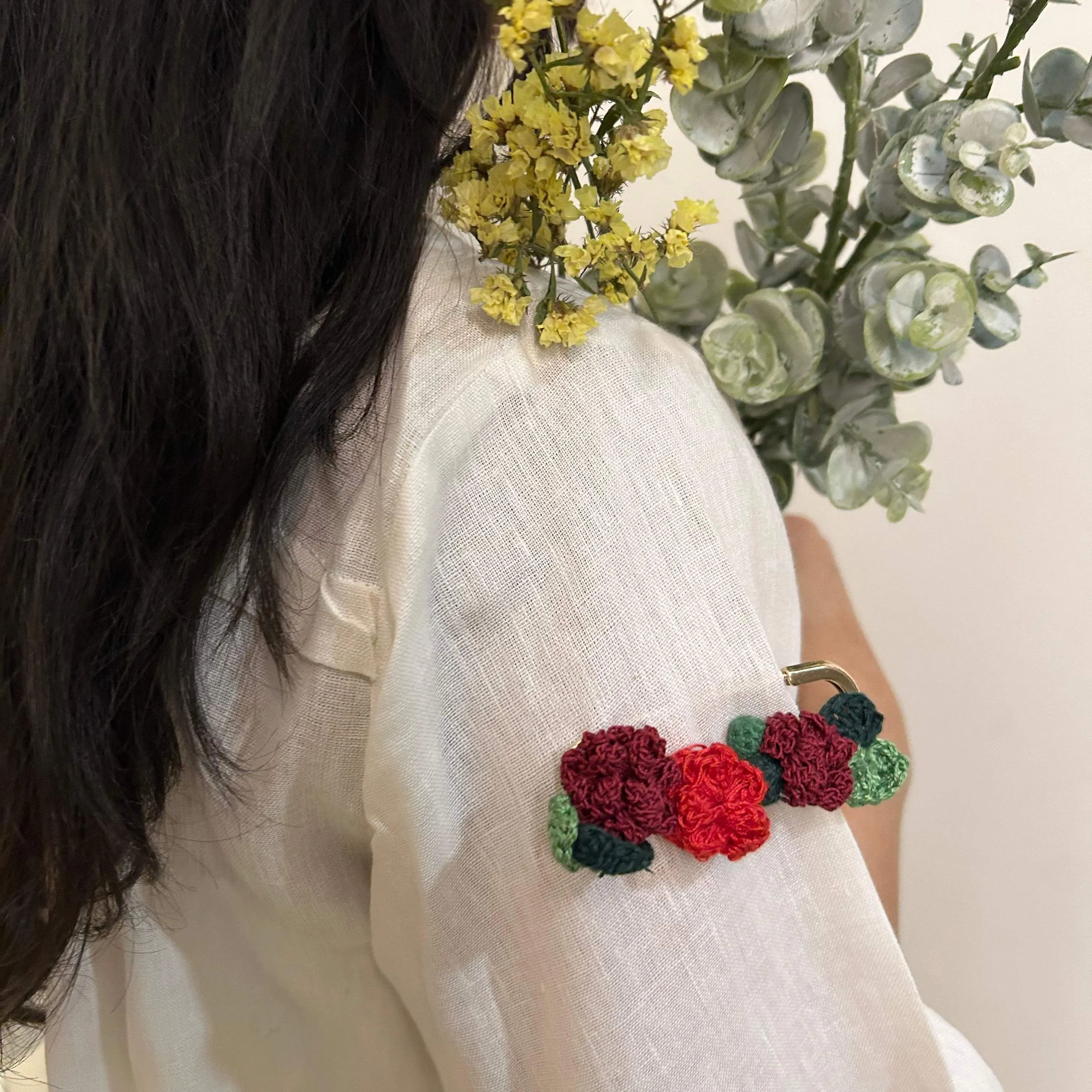 Rose crochet brooch on a metal pin