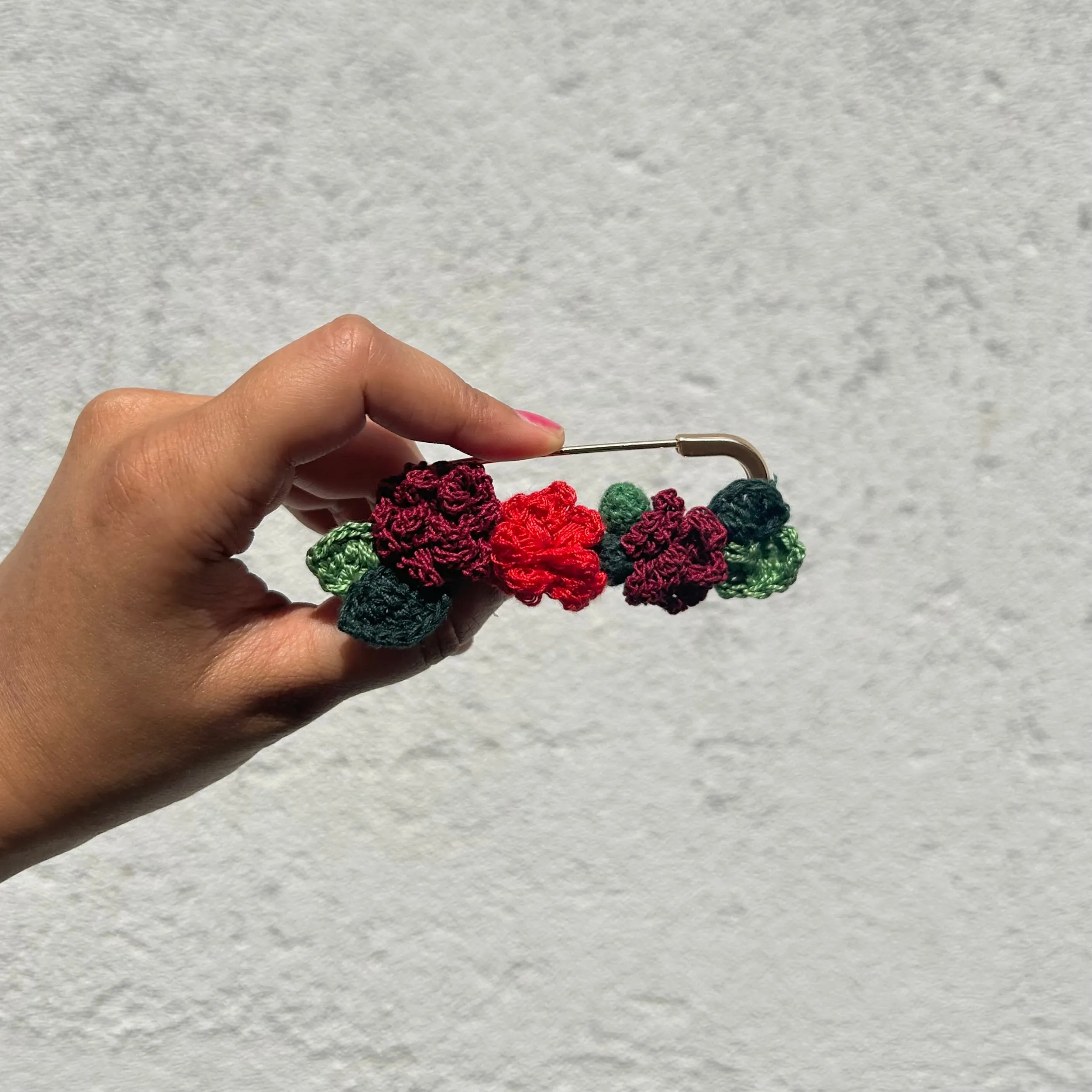 Rose crochet brooch on a metal pin