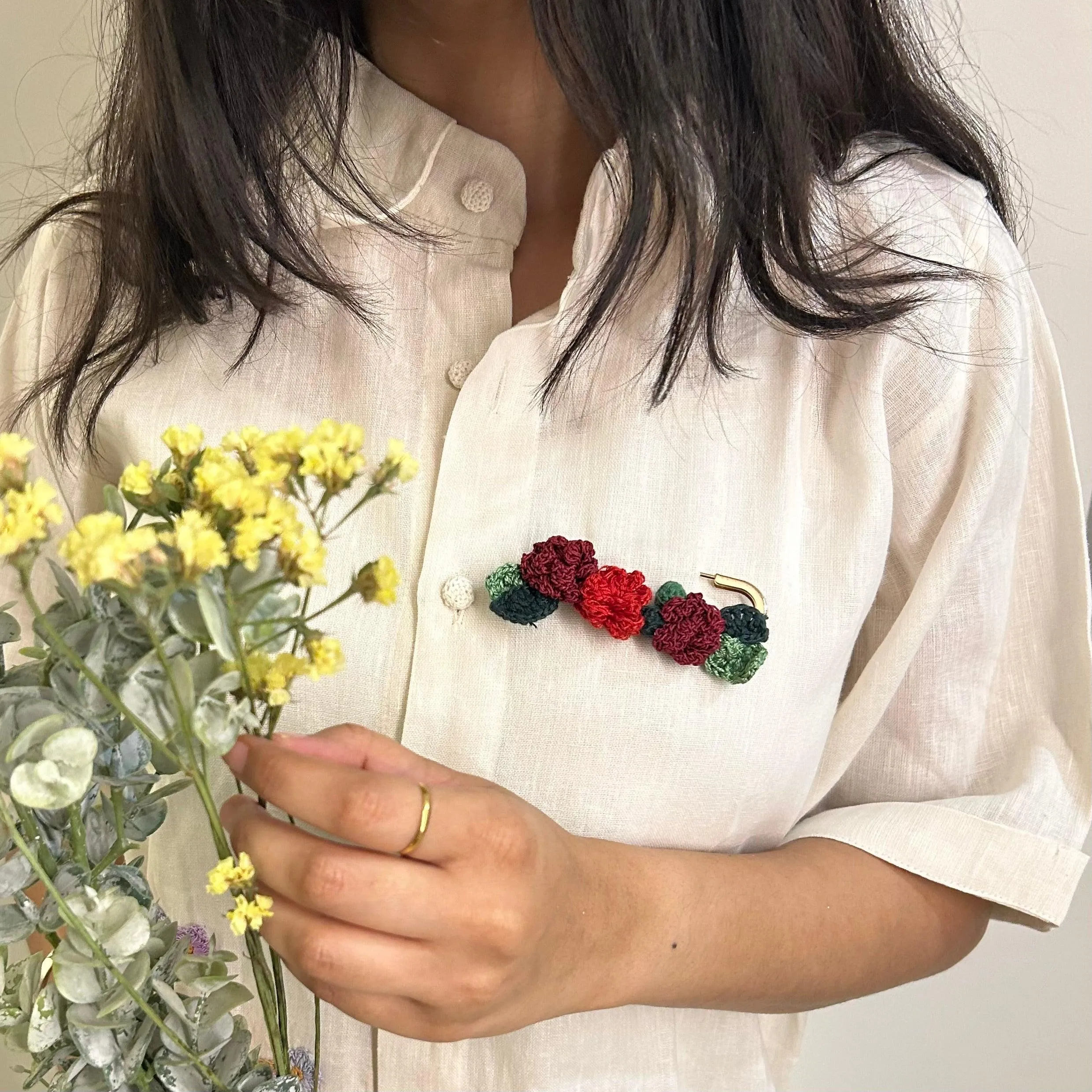 Rose crochet brooch on a metal pin